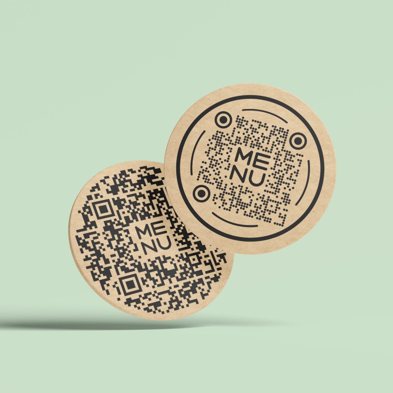 Two beer mats with decorative QR codes